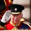 King wears black armband in memory of India air disaster at Trooping the Colour