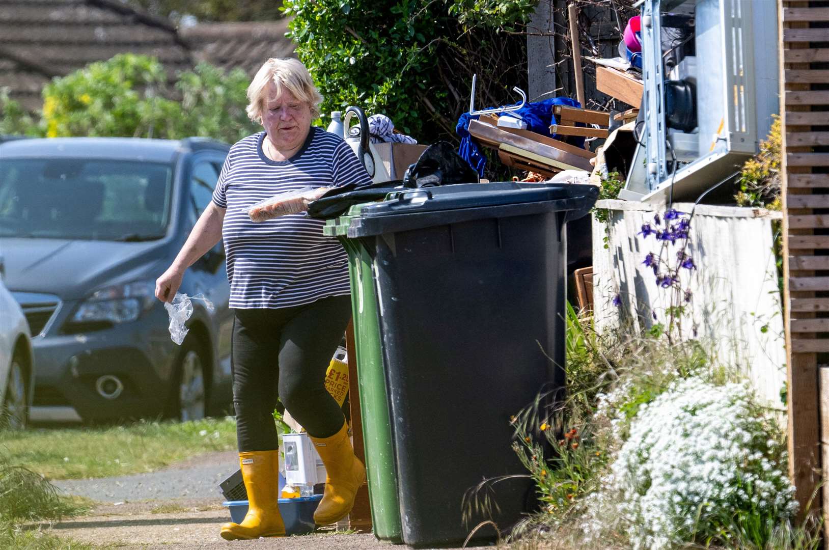 Sharon Cochrane outside her bungalow in Hunstanton, which has become an 'eyesore'. Picture: SWNS