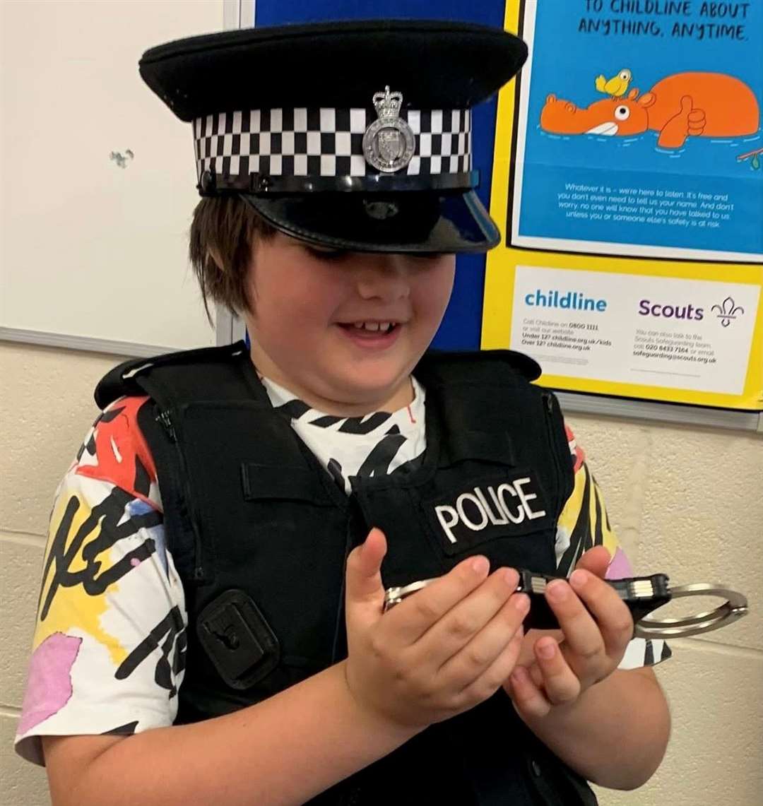 'ello, 'ello - what's going on here! A youngster all dressed up during the emergency services day