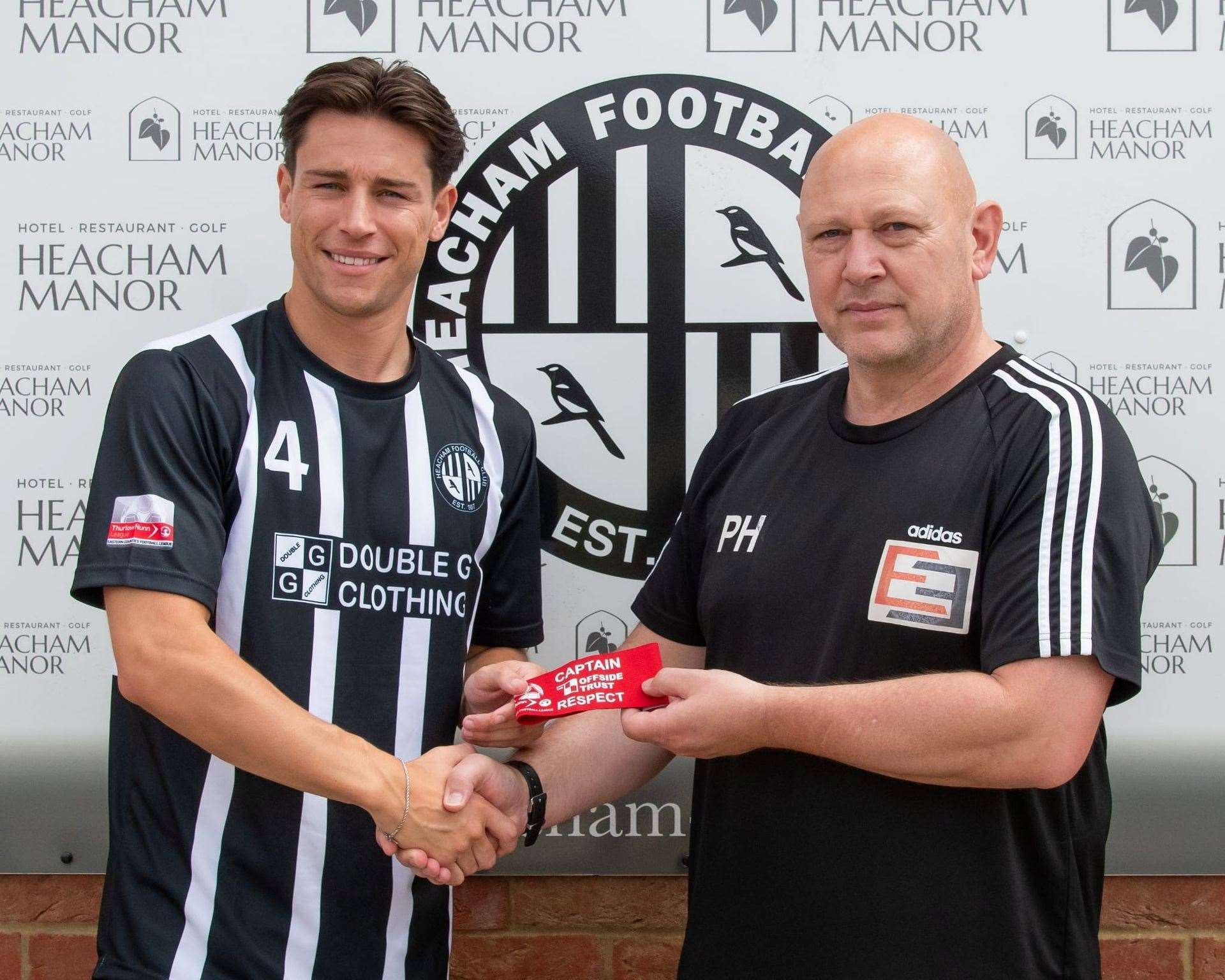 Callum Robinson being handed the captain's armband by manager Paul Hunt. Picture: Phil Gwilliam