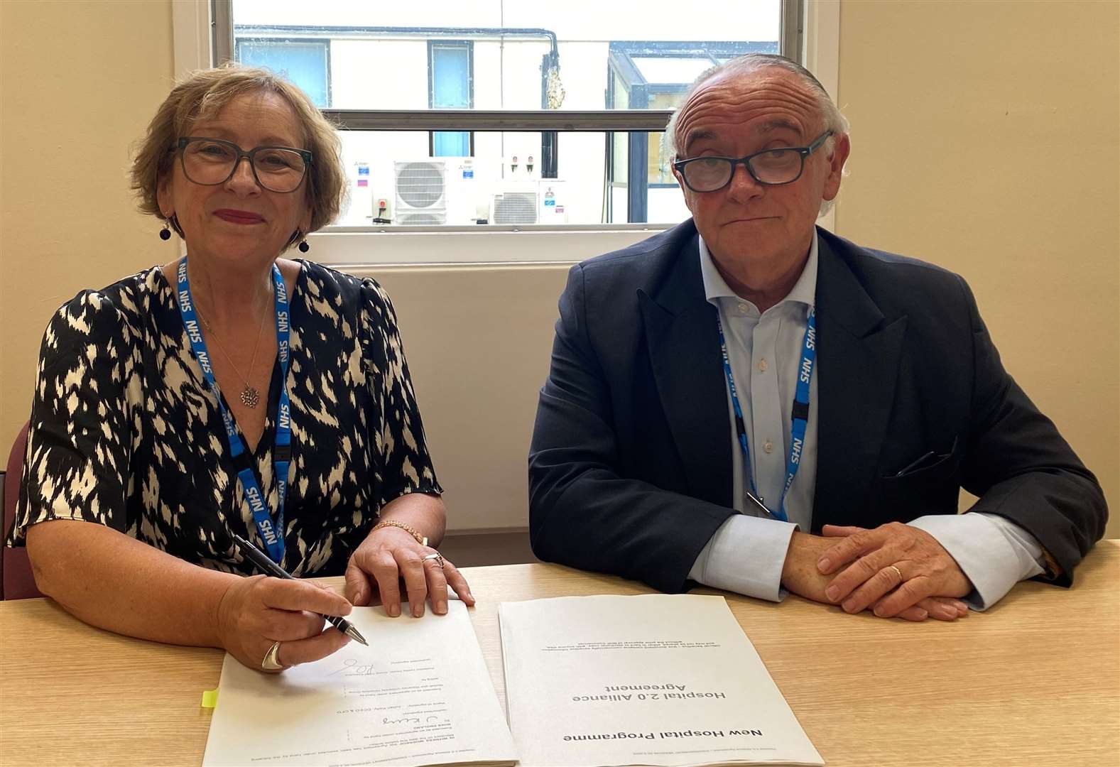 Professor Lesley Dwyer, Norfolk and Waveney University Hospitals Group CEO, and Chris Bown, interim executive managing director at the QEH, mark the agreement
