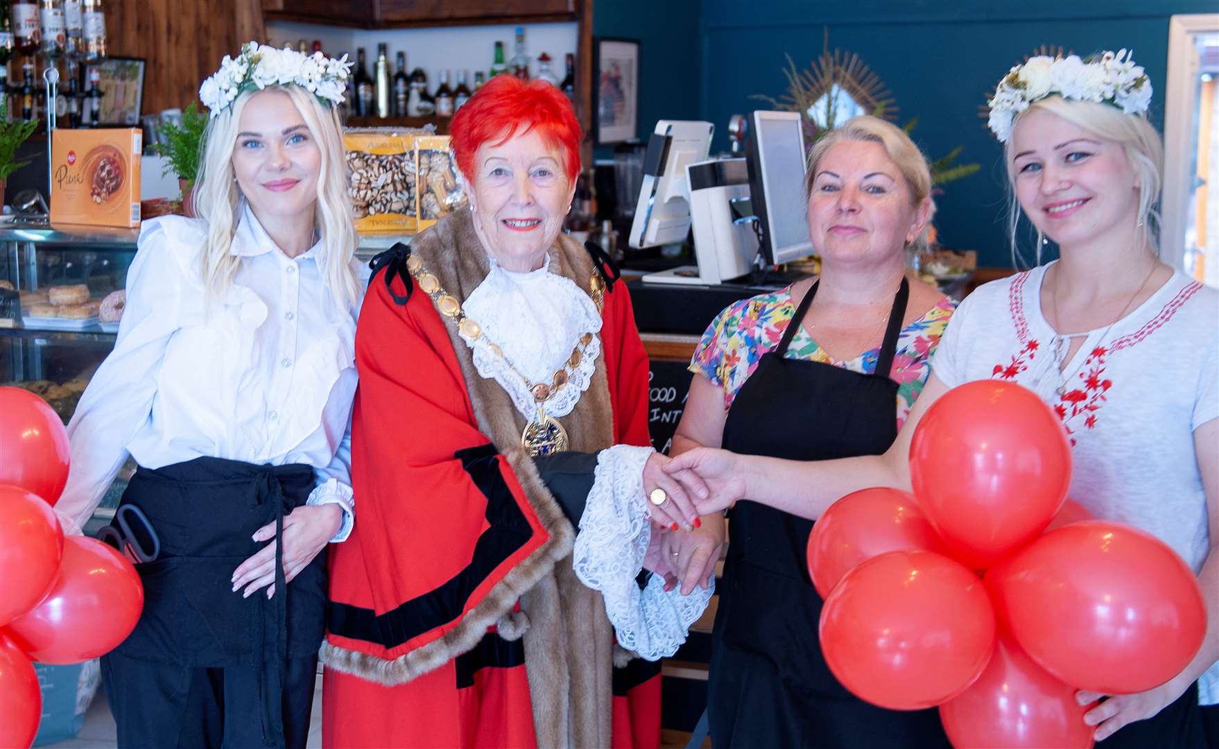 The New Sands Cafe on Gaywood Road King's lynn. Mayor Margaret Wilkinson with Owners Elina Mertena, Mertena Modrite, Amena Anastasiya.