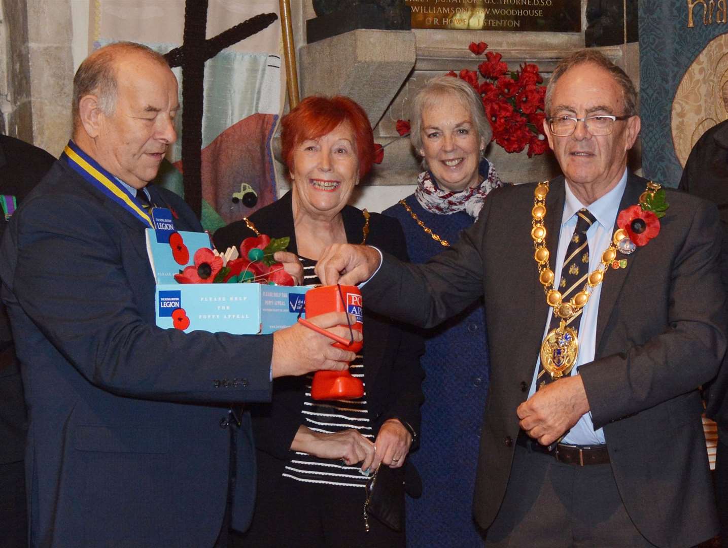 Borough Geoff Hipperson, buys the first poppy from county RBL chairman, Hugh King, watched by Margaret Wilkinson, who was and mayoress Rose Hipperson