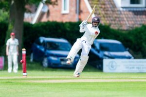 North Runcton strengthen position at the summit