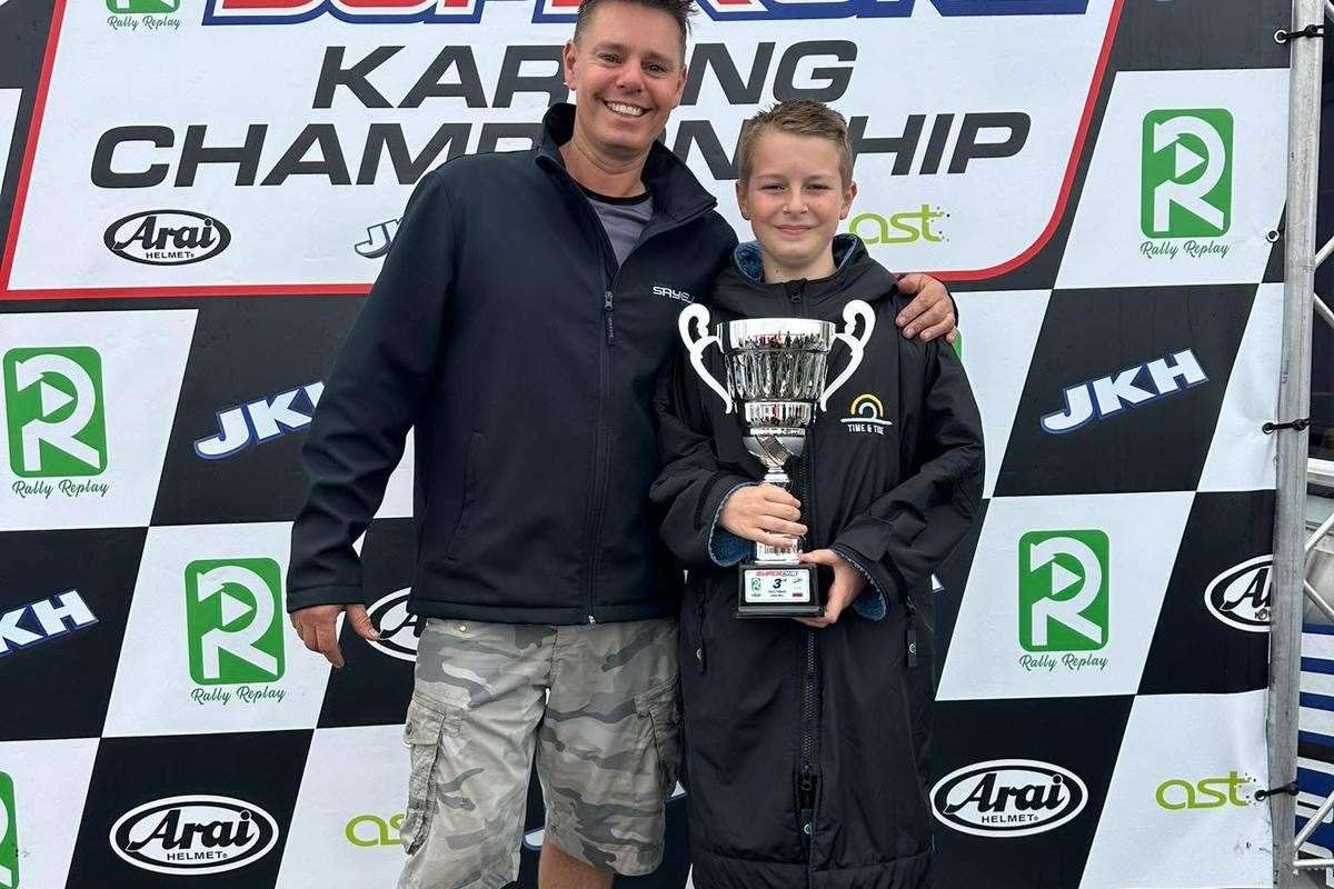 Jenson Sayell celebrates his top spot with his mechanic dad Rob. Picture: Stu Stretton