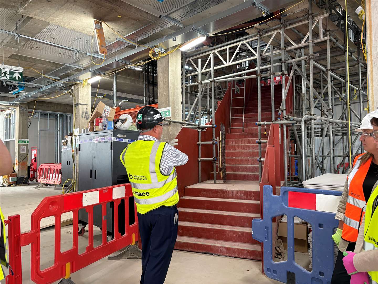 A large staircase leads up to the first floor