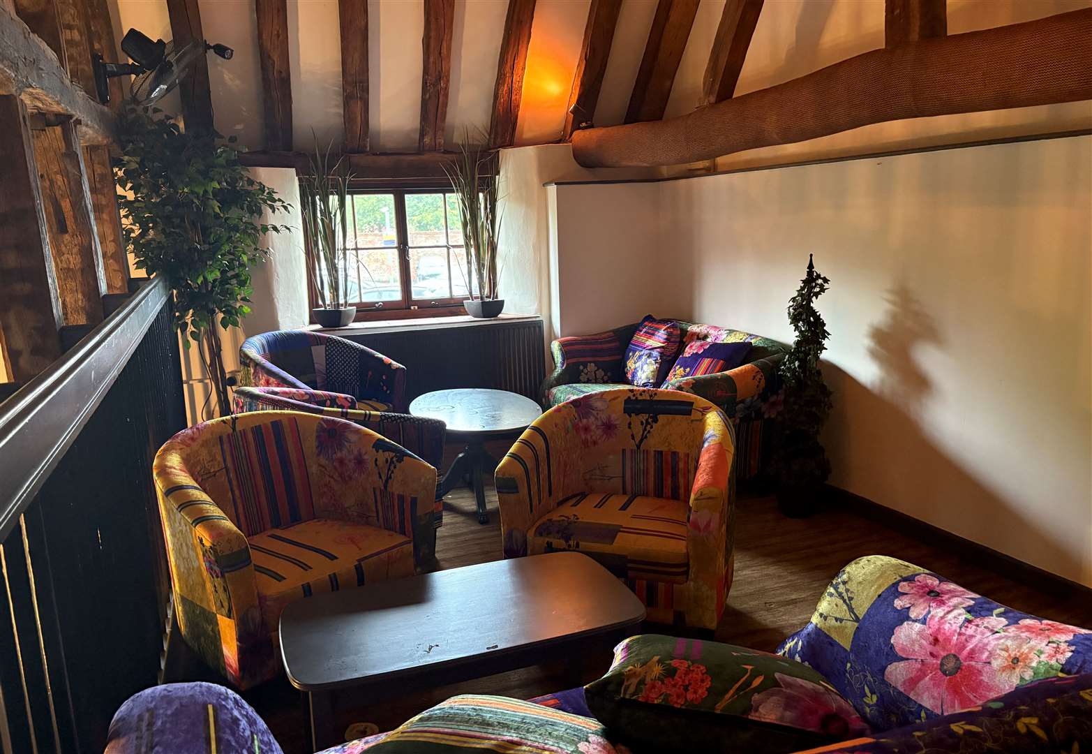 A comfy sofa area inside The Lattice House