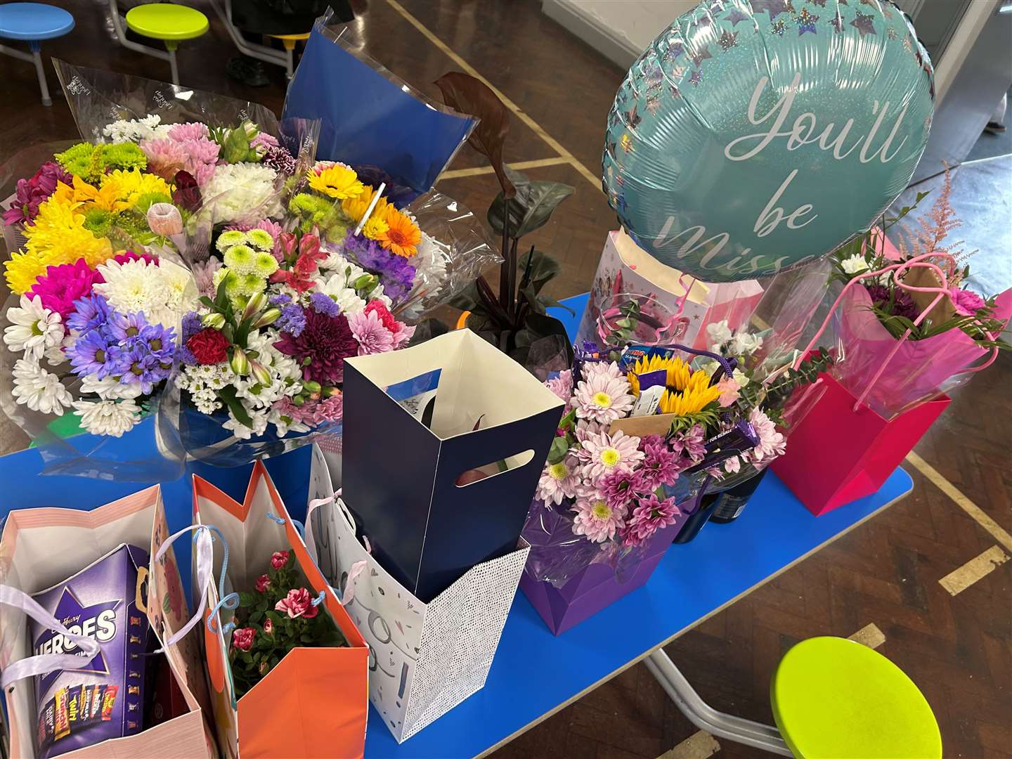 Pupils and staff gave Linda gifts to say thank you for what she has done
