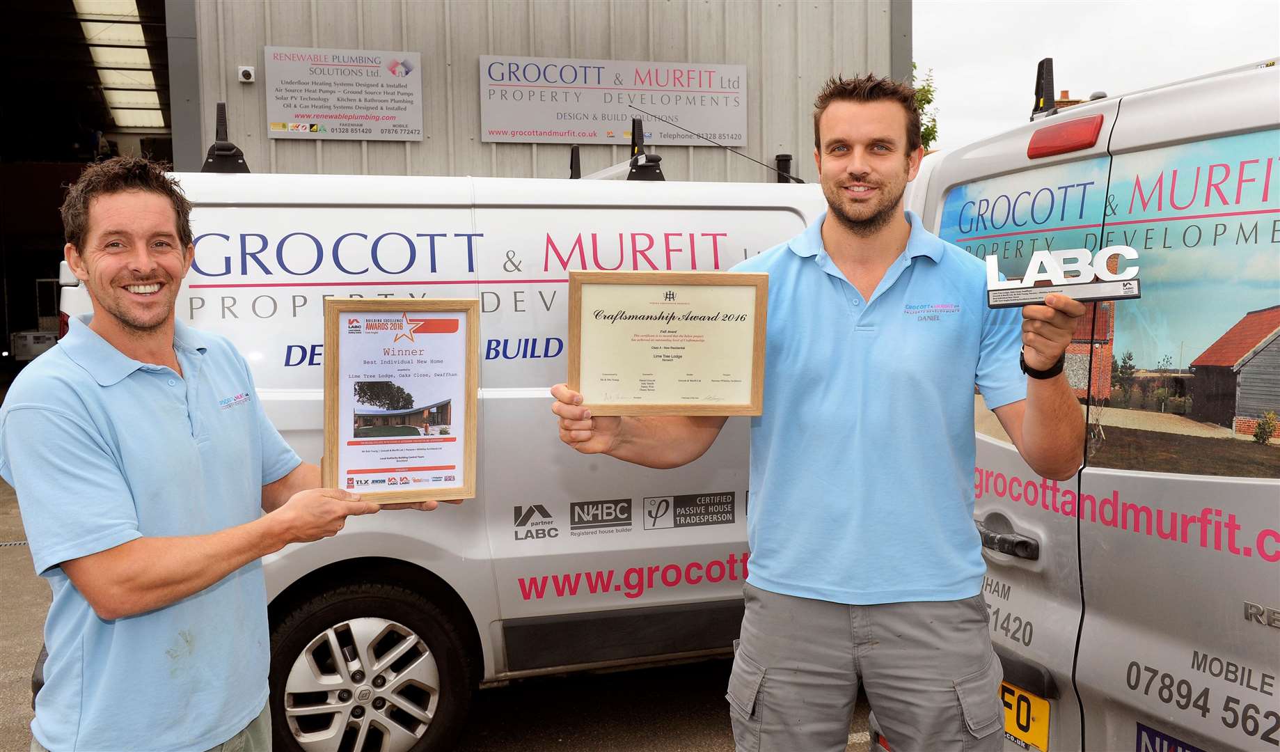 Grocott and Murfit won the Local Authority Building Control regional award for their Passivhaus (eco house), which they built at Swaffham, from left: Jody Murfit and Daniel Grocott with the awards in front of the Fakenham office