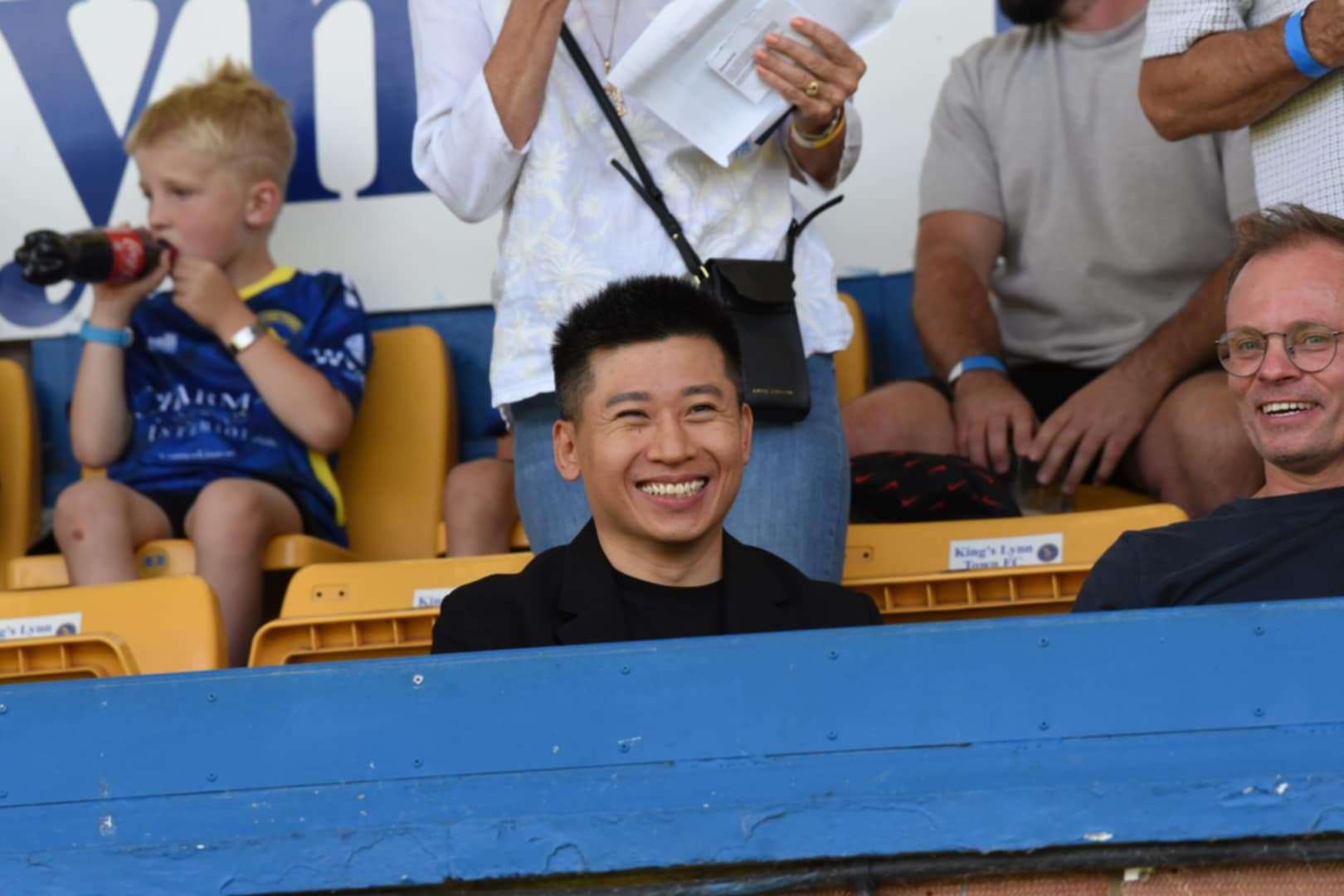 King's Lynn Town owner Joseph Phua watches from the main stand at the Docherty Walks Stadium. Picture: Tim Smith