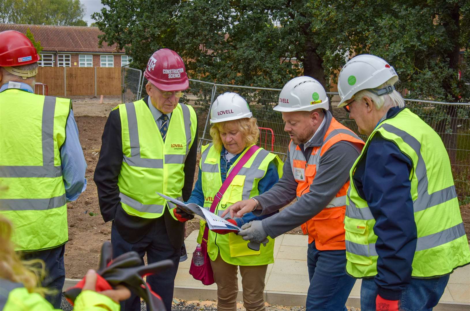 Dan Saxon, Lovell site manager at Florence Fields, showing councillors site plans. Picture: West Norfolk Council