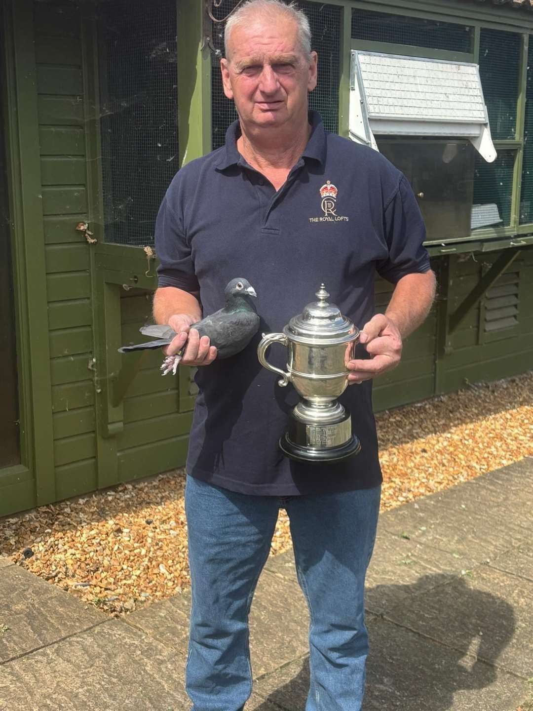 The royal loft manager Peter Farrow with the King's Cup.