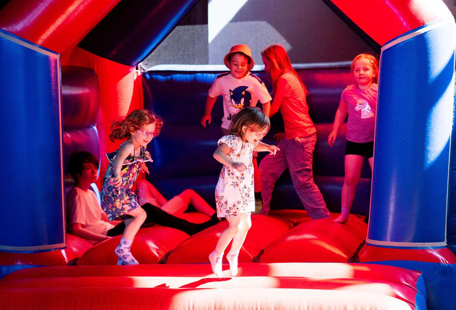 Getting rid of some energy on the bouncy castle. Picture: Ian Burt/Freebridge Community Housing