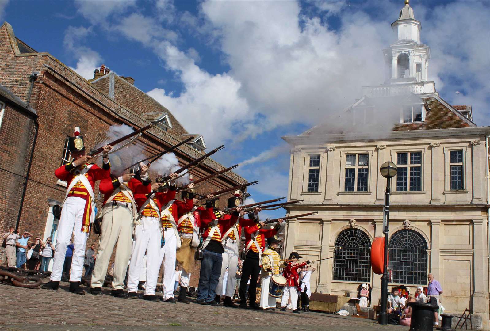 Flashback to a re-enactment outside the Custom House
