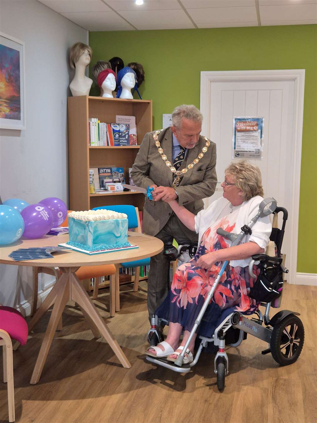 Diane Boothby and West Norfolk mayor Andy Bullen cut a cake at the event