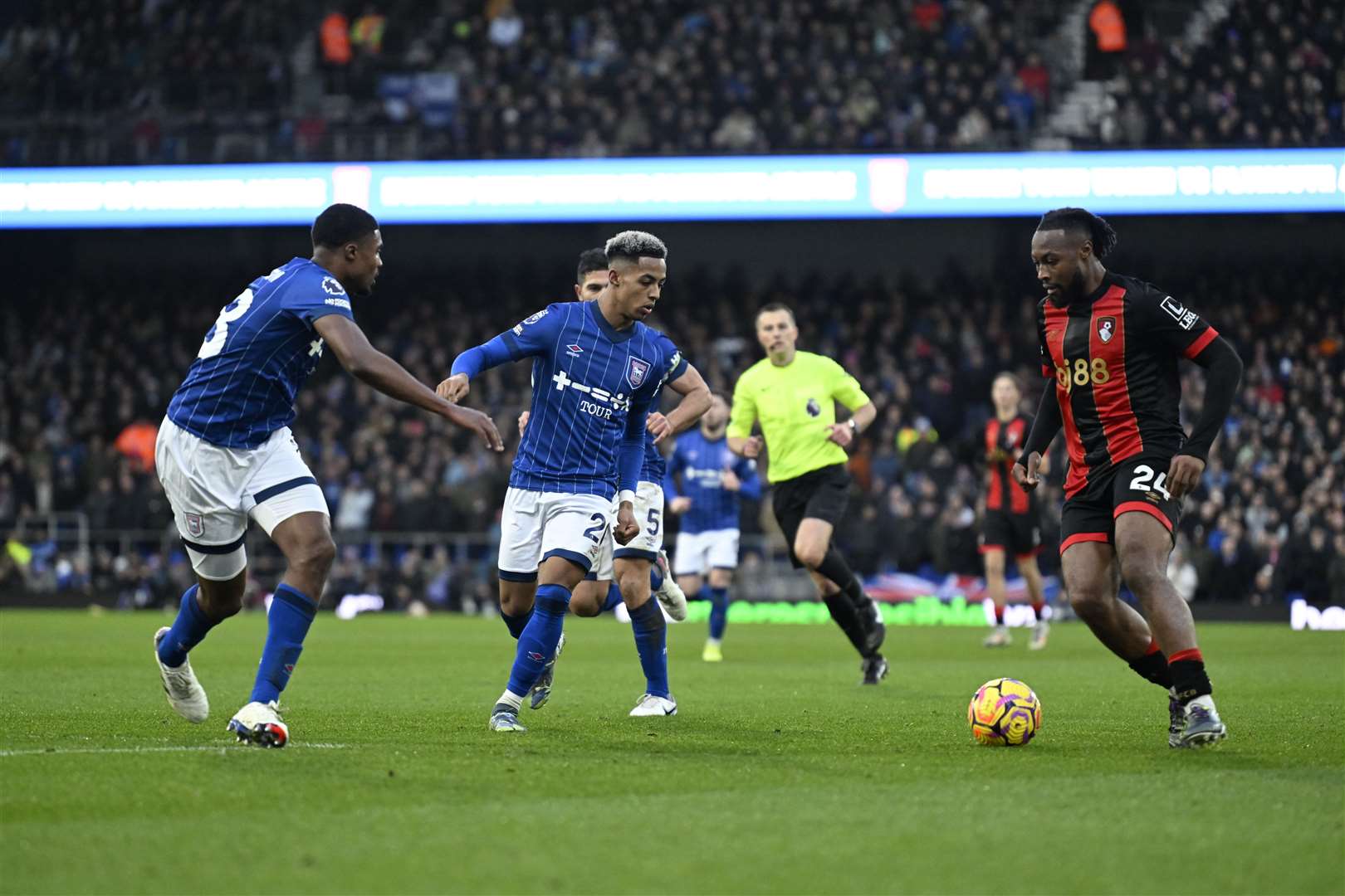 Antoine Semenyo looks for a way past Omari Hutchinson and Ben Johnson. Ipswich (blue) versus Bournemouth. Premiership. Ipswich Town FC, Portman Road, Ipswich. Photo: Barry Goodwin