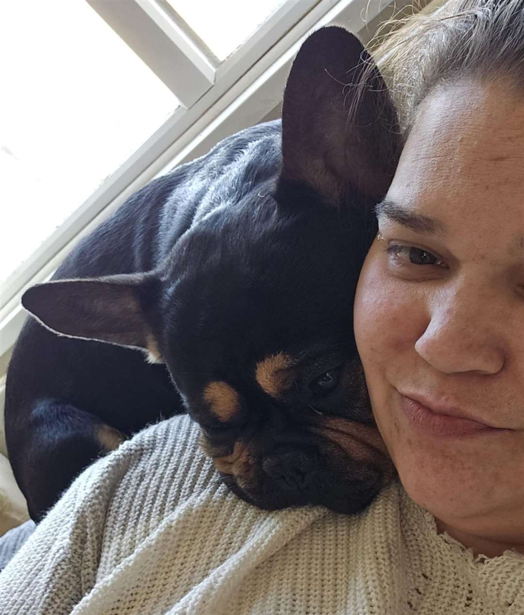 Emily with Benny, her three-year-old French bulldog