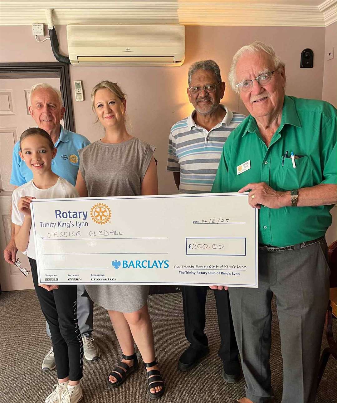 President Peter Harris presented Lucy Gledhill and her mum Jessica with the £200 cheque, alongside rotarians John Thorpe and Virendra Patel