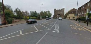 Busy road into town centre closed following two-vehicle crash