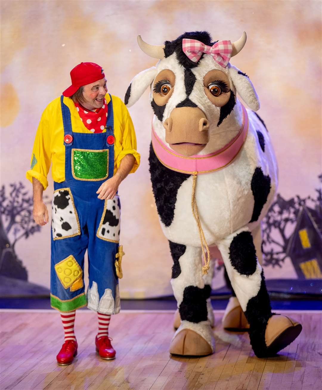 Silly Billy - alias funny man Scott Cripps with the panto cow.