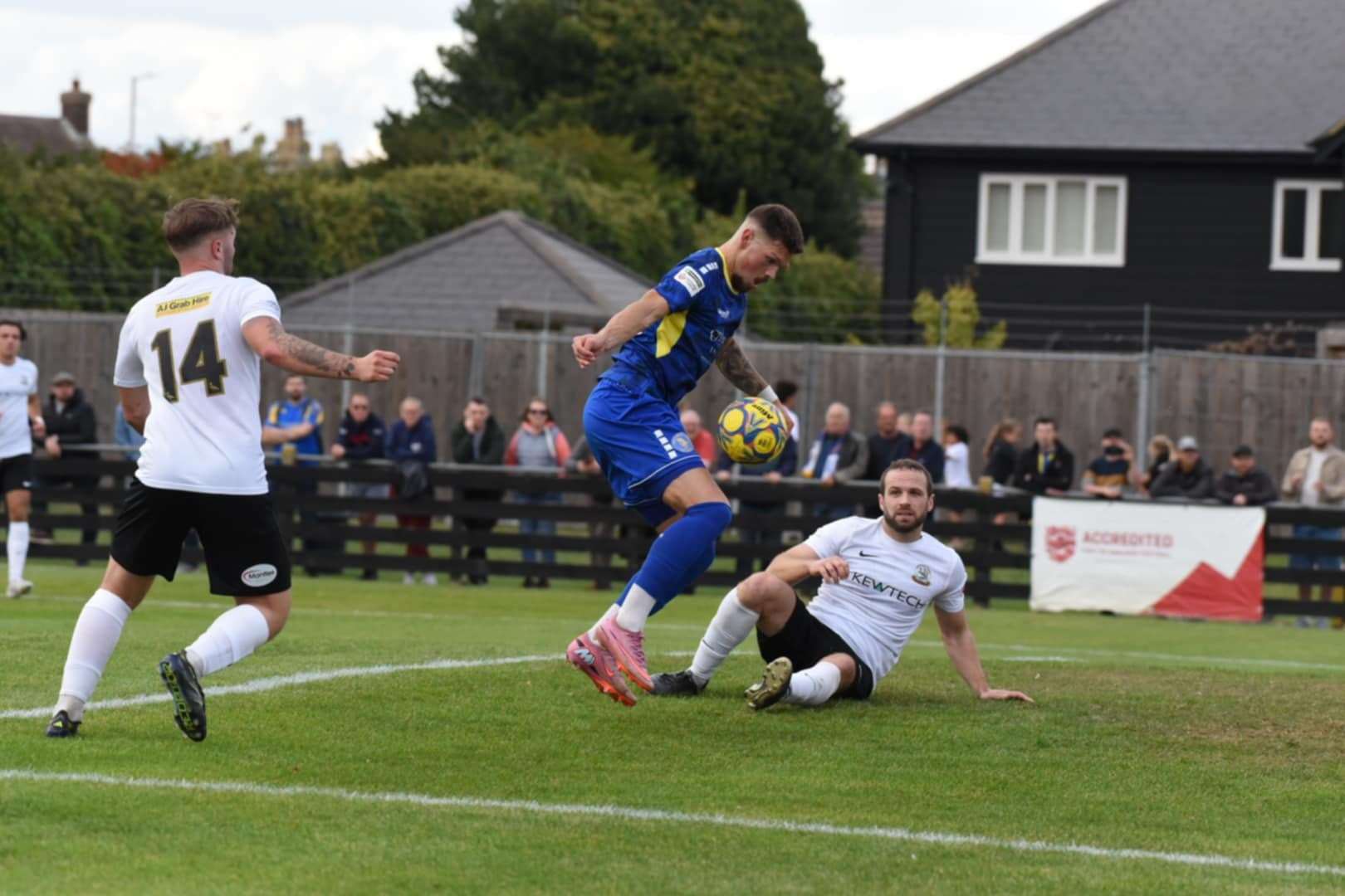 Ross Crane is denied by a Royston Town player. Picture: Tim Smith