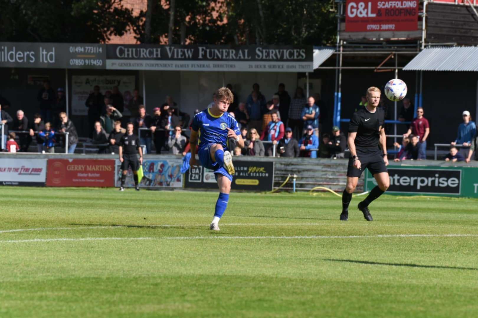 Morgan Williams curls home a free-kick for Lynn's opening goal of the afternoon at Chesham. Picture: Tim Smith