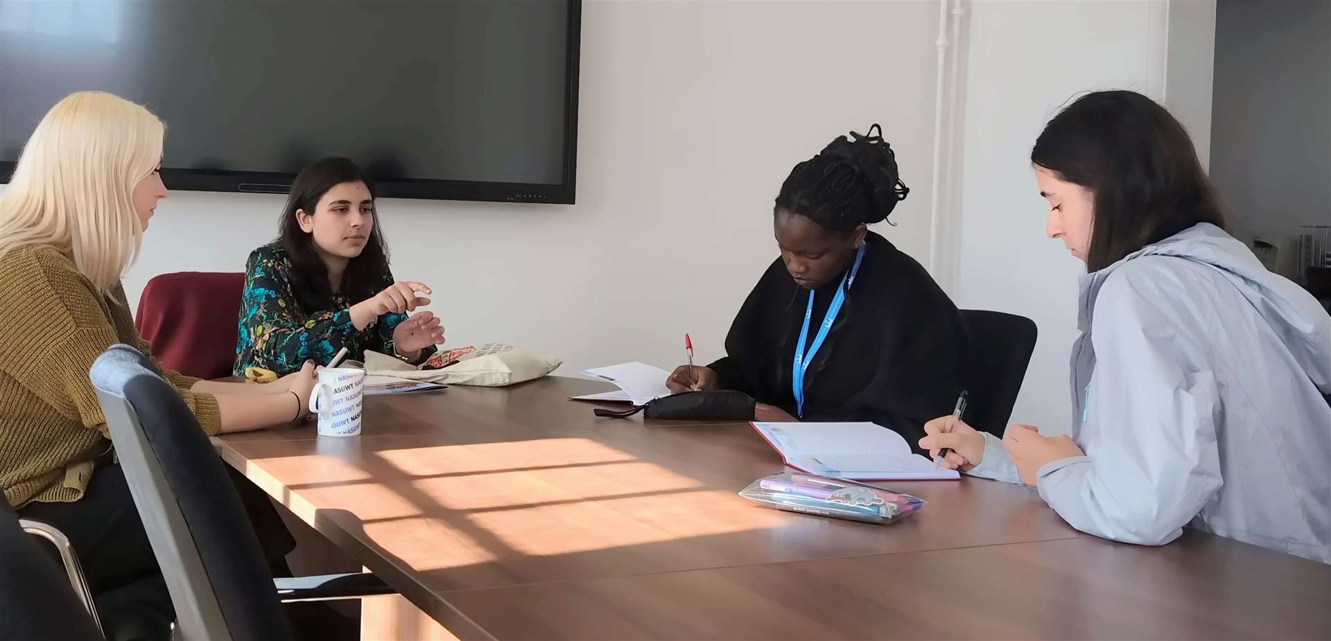 Alina (second from left) meeting with KES students