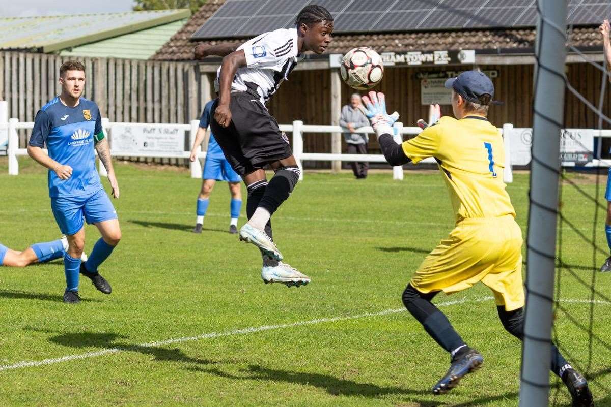 Helkias Acheampong heads into the arms of the Rovers keeper. Picture: Eddie Deane