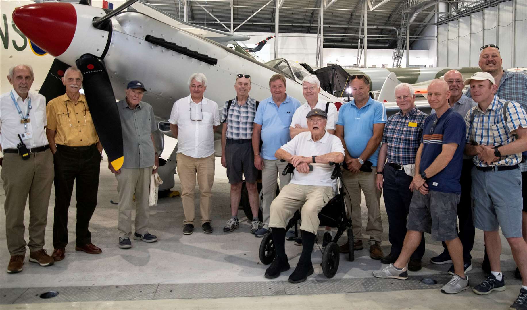 Surprise for Eric Lamb, 94, who is pictured with Probus members and son Adam next to the Spitfire on which he worked years ago. Picture: James Nash