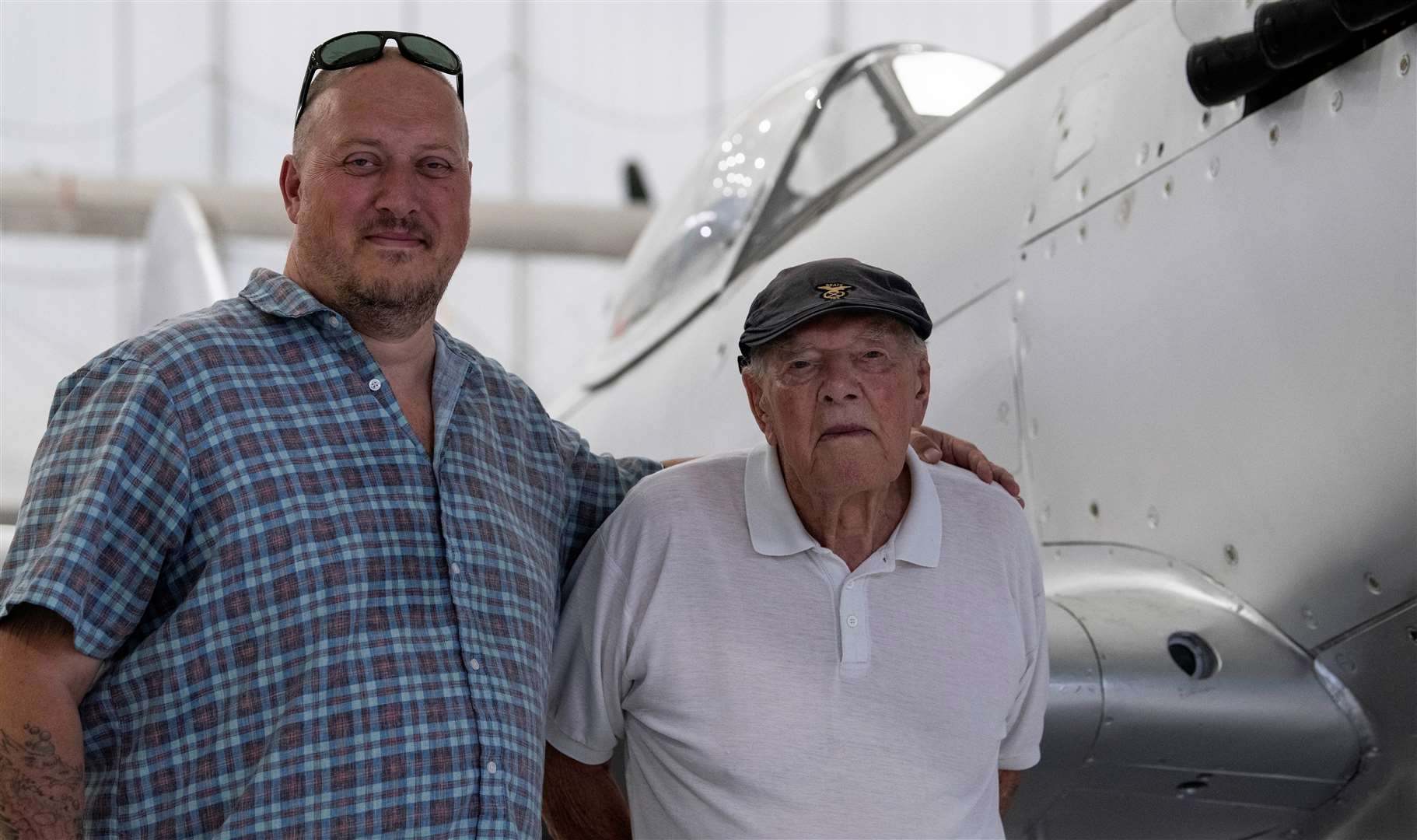 Eric Lamb and son Adam standing next to the Spitfire. Picture: James Nash