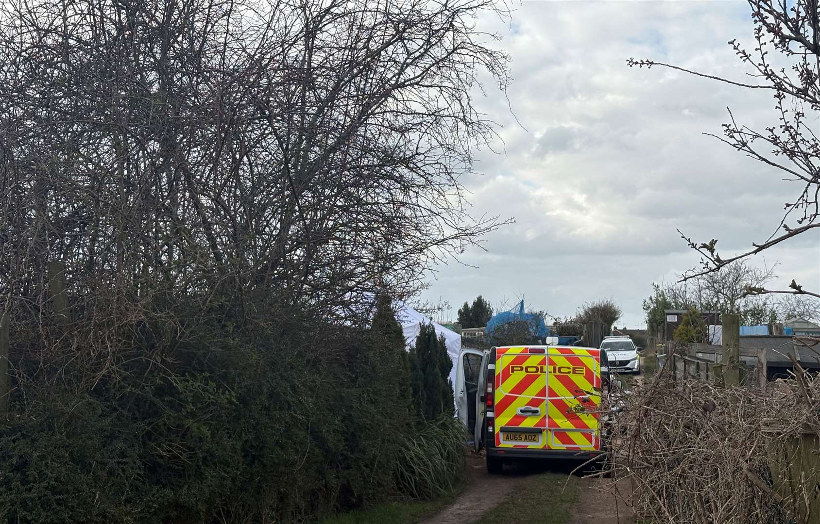 A forensic tent and multiple police vehicles were seen at the North Lynn allotments back in March